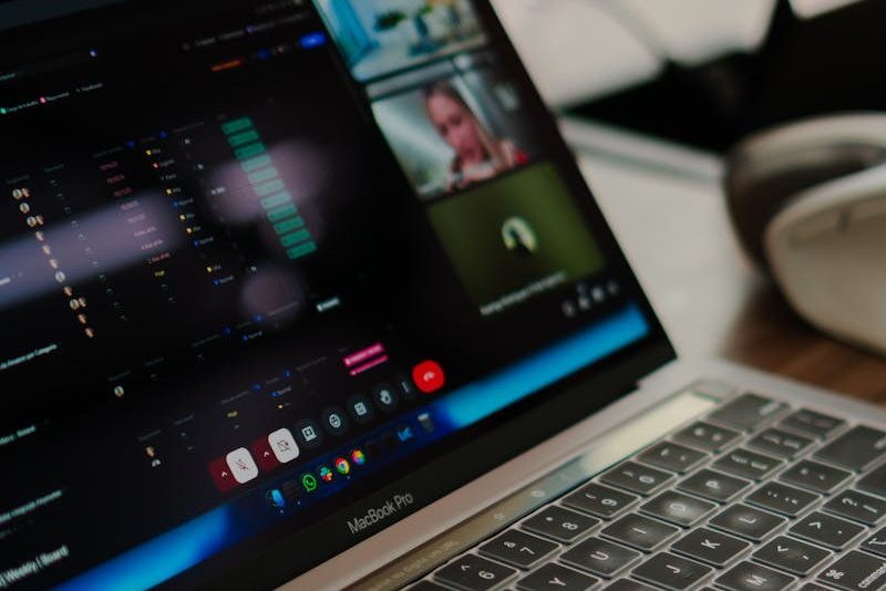 A laptop showing a video conference call, ideal for remote work concepts.